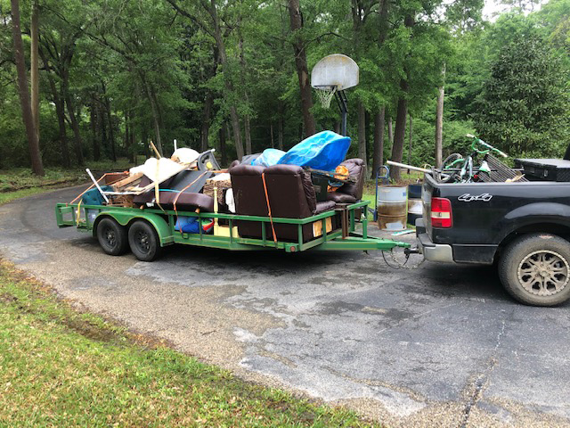 loaded junk hauling trailer